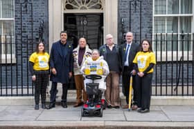 Football pundit Chris Kamara MBE (2nd left) handing in a petition, from the end-of-life charity Marie Curie, to Downing Street calling for improved financial support for people with a terminal illness, alongside terminally ill campaigners Tammy Prescott and Cheryl Whittaker, and their husbands Lintyn and Mark. Picture date: Thursday February 23, 2023. PA Photo. Photo credit should read: Jeff Moore/PA Wire