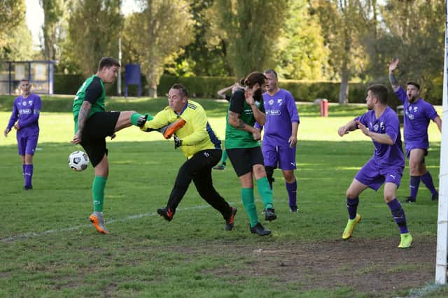 The Gosham Rangers Reserves keeper gets a boot in his chest against Saturn Royale. Picture by Kevin Shipp