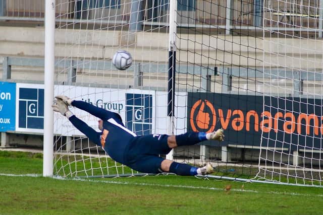 A diving Ross Worner can't keep out Jack Barham's penalty. Picture: Kieron Louloudis.
