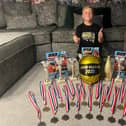 Jenson Ansell with his British Mini Super Bike Championship trophy and medals