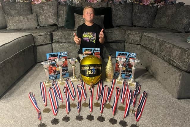 Jenson Ansell with his British Mini Super Bike Championship trophy and medals