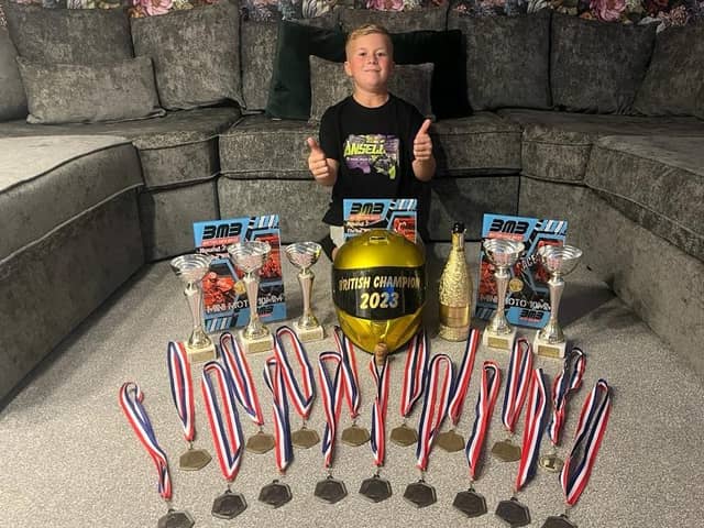 Jenson Ansell with his British Mini Super Bike Championship trophy and medals