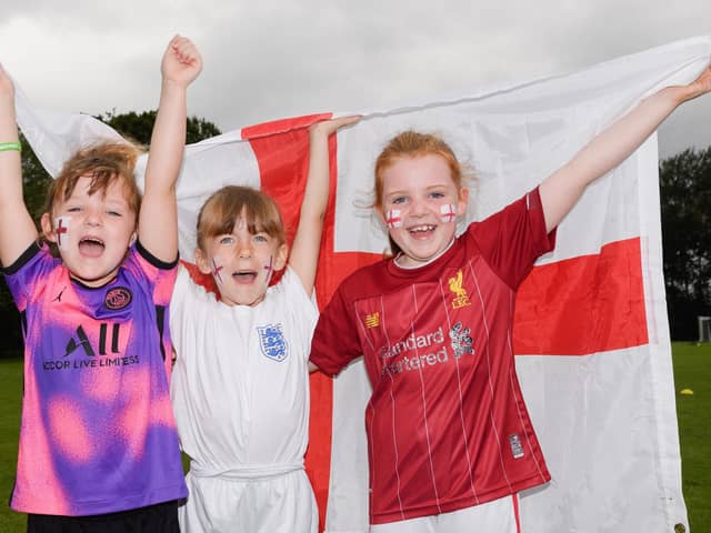 Stubbington Youth FC teams supporting England in the Euro 2020Pictured is: Elisa, Olivia and Mia cheer on England.Picture: Keith Woodland (110721-25)