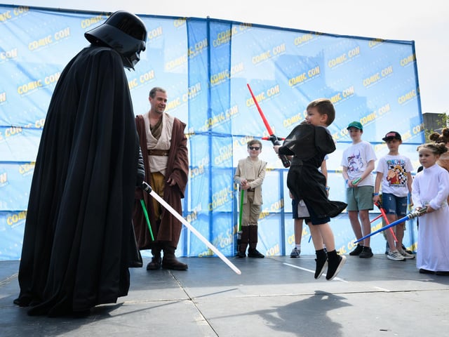 A light saber fight with Darth Vader. Picture: Keith Woodland (110521-81)