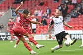 Connor Ogilvie, pictured getting in a block on Doncaster's Kyle Knoyle, is seen by Danny Cowley as being an ideal candidate for his Pompey back three. Picture: Howard Roe/AHPIX LTD