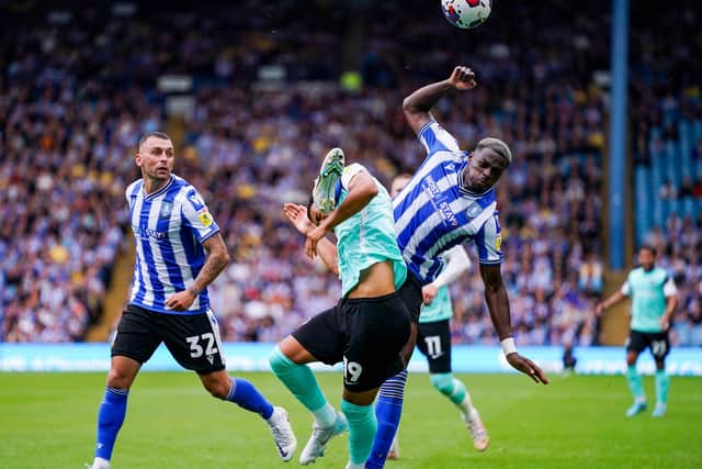 Dane Scarlett is caught by a high challenge from Dominic Iorfa which left Pompey stunned when a penalty wasn't awarded.