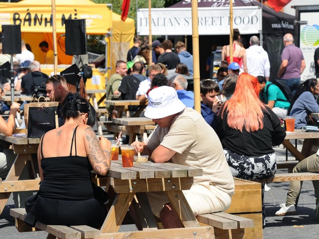 People made the most of the sunny conditions to enjoy the Street Food Festival. Picture: Sarah Standing (010825-1420)