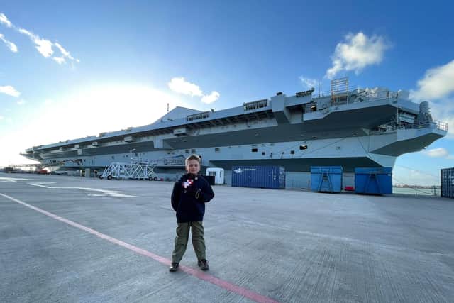 The eight-year-old lad from Leeds was one of a number of children invited to tour the aircraft carrier in Portsmouth