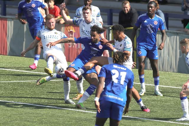 In the thick of it - Jake McCarthy and Joash Nembhard, with ex-Hawk Stefan Payne. Picture by Dave Haines.
