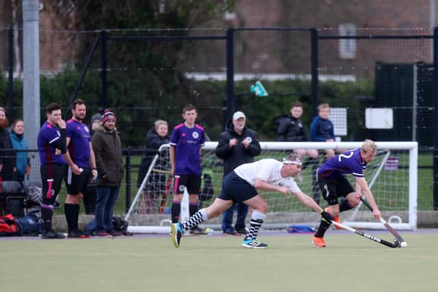 Matt Simpson, right, battles for possession during Portsmouth 2nds' home loss to Isle of Wight. Picture: Chris Moorhouse