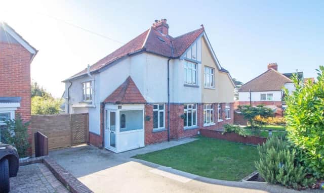 This property comes with three bedrooms, two bathrooms and a reception room as well as a garden and parking.