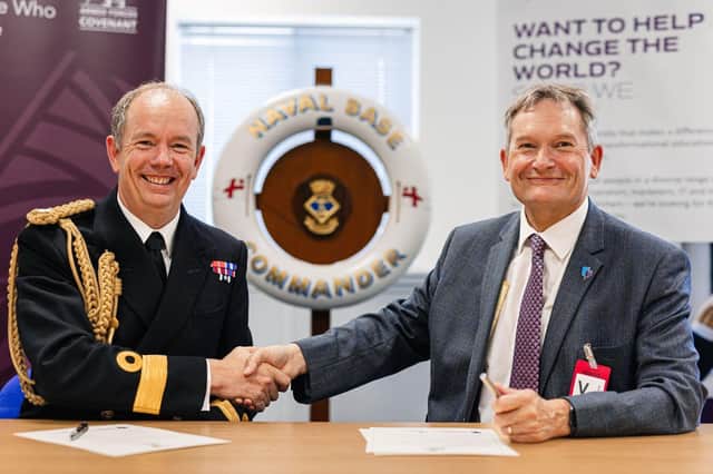 Naval Base Commander, Commodore John Voyce, left, signing the covenant with Professor Graham Galbraith, Vice-Chancellor of the University of Portsmouth