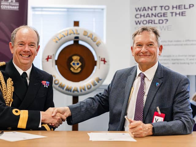 Naval Base Commander, Commodore John Voyce, left, signing the covenant with Professor Graham Galbraith, Vice-Chancellor of the University of Portsmouth
