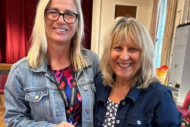 Sam Jones Jill’s consultant proudly presenting Jill with her target certificate her smile says it all.