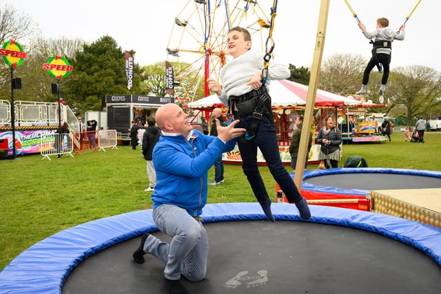 Southsea Travelling Funfair is proving popular with locals. The funfair is currently on Castle Field, Southsea, and will be there until May 6, 2024. Pictured is: Rob and Jimmy Hayward enjoying time on the trampolinesPicture: Keith Woodland (270421-45)
