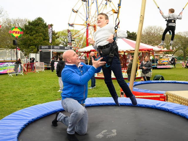 Southsea Travelling Funfair is proving popular with locals. The funfair is currently on Castle Field, Southsea, and will be there until May 6, 2024. Pictured is: Rob and Jimmy Hayward enjoying time on the trampolinesPicture: Keith Woodland (270421-45)