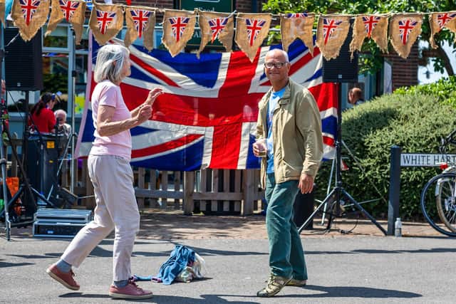 Janet Lightowler, 78, and Richard Gowen, 73, enjoying the 50s soundtrack from the White Hart during the Stoke Road Community Festival in Gosport. Picture: Mike Cooter (040622)