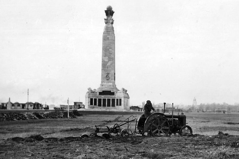 With the  Royal Naval Memorial to the rear we see Southsea Common being ploughed for vegetable growing. Undated