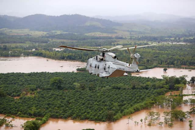 Merlin helicopters of 845 Naval Air Squadron flying a sortie over flooded Honduras in the wake of hurricanes Eta and Iota.