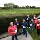 Nutbourne residents, including Dave King, front left, are concerned about proposals to build 1,250 homes in Southbourne Parish. The land behind them lies within the plans
Picture: Chris Moorhouse (jpns 250521-05)