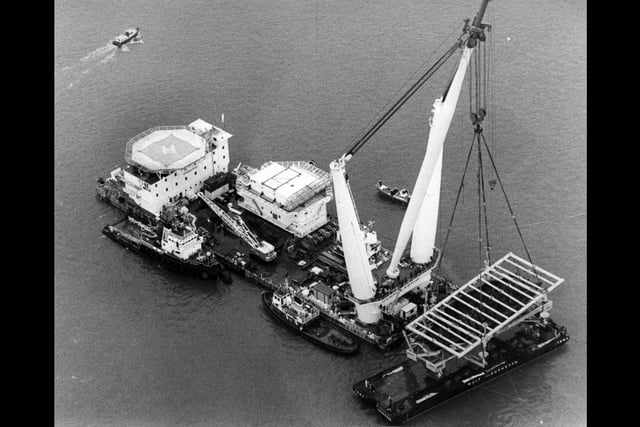 An aerial shot of the giant Tog Mor crane lowering the Mary Rose onto her barge on October 11, 1982. The News PP3739