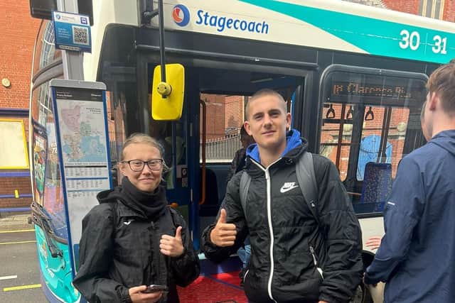 PompeyITC students in front of a Stagecoach bus