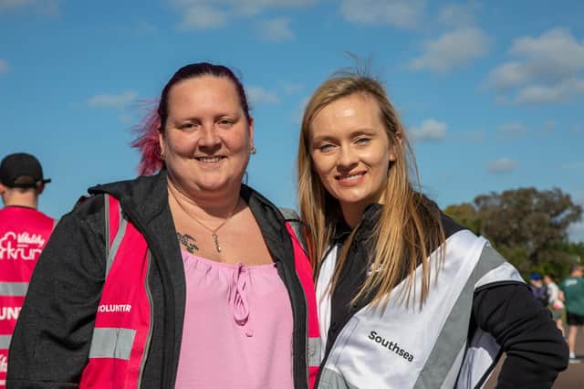 Rhian Gough, left, was volunteering in her 100th parkrun, alongside her is Southsea run director Emma Cardey Picture: Mike Cooter (280522)