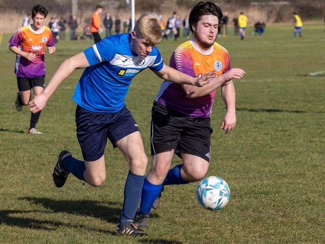 Bulldog (blue) v King George Rovers. Picture: Mike Cooter