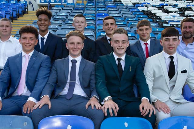 Eight new Pompey scholars pen two-year deals at Fratton Park. 
Back row: Academy chief Mark Kelly, Haji Mnoga, Alfie Stanley, Harry Kavanagh, Stan Bridgman and coach Liam Daish.
Front row: Tom Bruce, Ethan Robb, Liam Kelly and Leon Pitman
Picture: Portsmouth FC