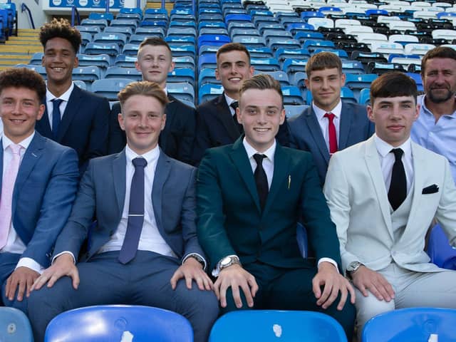 Eight new Pompey scholars pen two-year deals at Fratton Park. 
Back row: Academy chief Mark Kelly, Haji Mnoga, Alfie Stanley, Harry Kavanagh, Stan Bridgman and coach Liam Daish.
Front row: Tom Bruce, Ethan Robb, Liam Kelly and Leon Pitman
Picture: Portsmouth FC