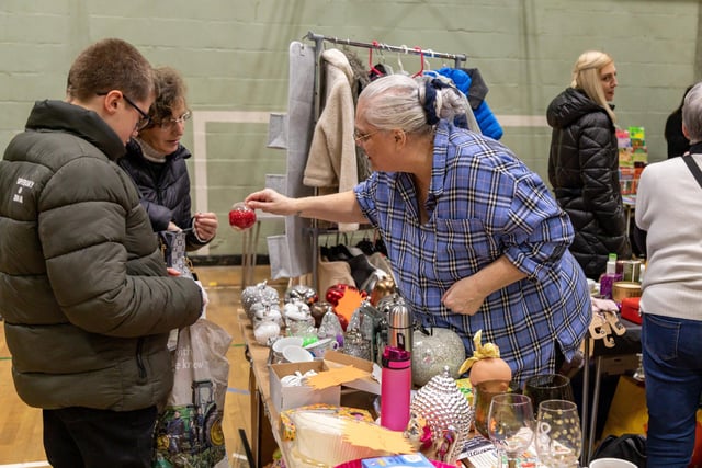 Customers at the busy  Fratton Christmas Fair. Picture: Mike Cooter (091223)