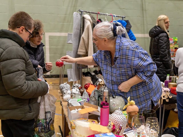 Customers at the busy  Fratton Christmas Fair. Picture: Mike Cooter (091223)