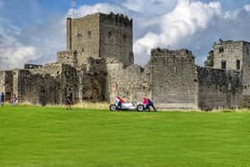 Wheeling away one of the exhibits at the end of filming for the BBC's Antiques Roadshow at Portchester Castle on October 1, 2021. By Trev Harman