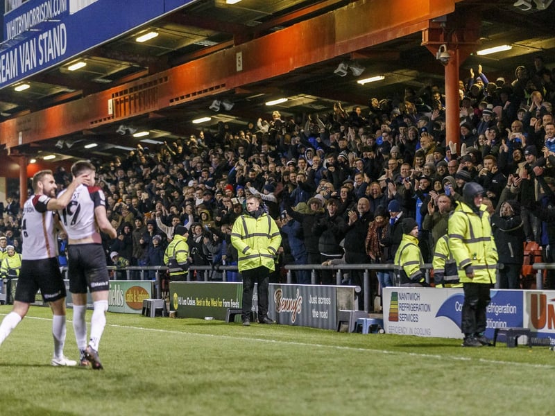 The Pompey fans celebrate George Hirst's goal in the 3-1 win at Crewe on March 8 - the Blues' third straight win in League One and a victory that stretched the side's unbeaten run to seven games.