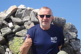 67-year-old Robin Moriarty at the summit of Carn an Righ.