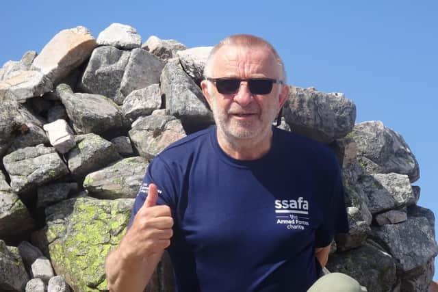 67-year-old Robin Moriarty at the summit of Carn an Righ.