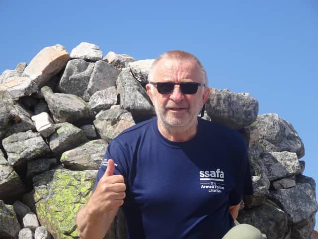 67-year-old Robin Moriarty at the summit of Carn an Righ.