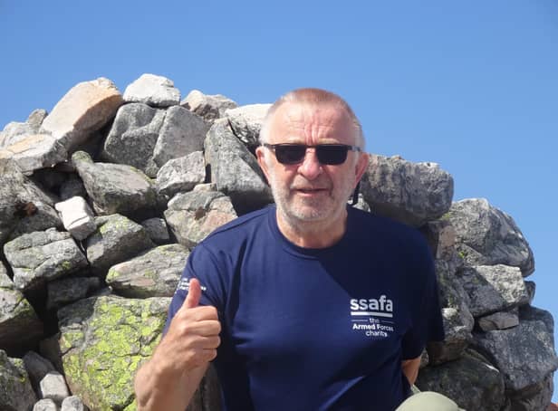 67-year-old Robin Moriarty at the summit of Carn an Righ.