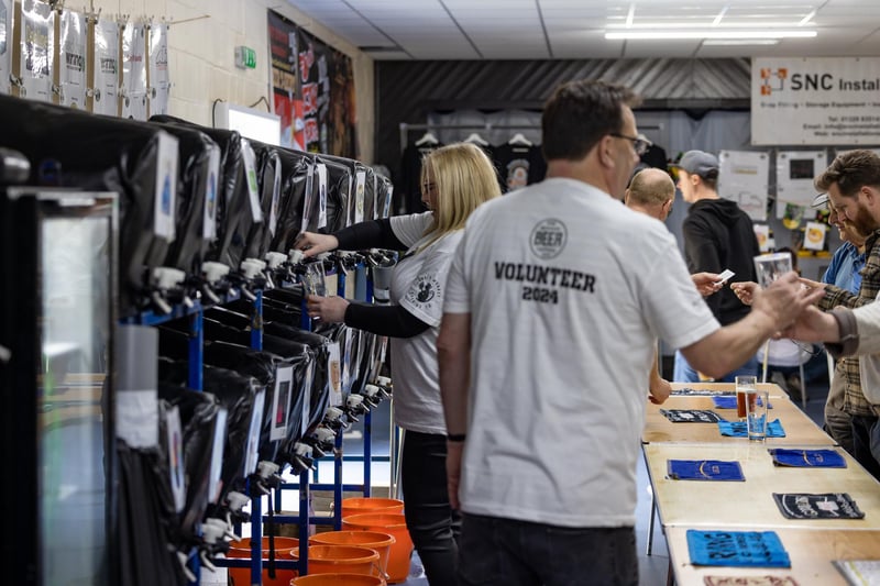 The busy serving area at the Wickham Beer Festival. Picture: Mike Cooter (060424)