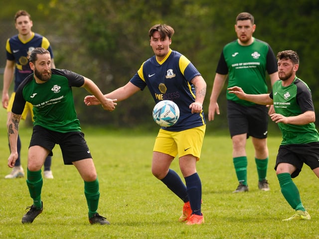 Action from Saturn Royale's 1-0 win over Pelham Arms (blue and yellow kit) in the second Adelaide Cup semi-final. Picture: Keith Woodland (300421-640)