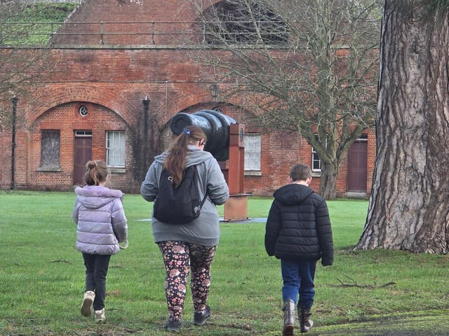 Poppy (7), Squirrel Scout Volunteer Hedgehog and Kyron (7) head off to hide quiz answers for their Scavenger Hunt.