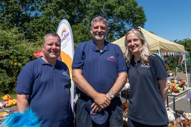 Staff members helping out during the Rainbow Centre Family Fun Day. Pictured: Vince Stevens (Head of Retail), Inigo Churchill (Executive Director) and Melanie Glock (Charity Shop Manager). Picture: Mike Cooter (240623)