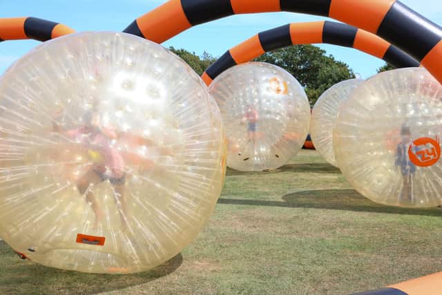 Families could take part in zorbing during the Wave fundraising festival on Hayling Island