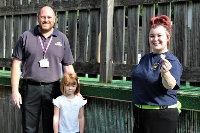 Barry Jenkins, security officer at St Mary's Hospital in Portsmouth, with his daughter Ayla and Nikki James from Dolls House Nursery