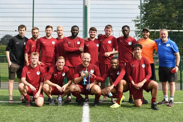 Burrfields with the Oscar Owers Cup. Back (from left): Jordan Shuttleworth, Max Bleach, Tom Duff, Charles Flatman, Jesse Parkis, Joe Western, Josh Currie, Kevin Parry, Duane Gray, Brian Kirby (manager). Front: Sam Lucas, Jack Palmer, Richie Leader (captain), Clinton Uzochukwu and Ali Shioui. Picture: Neil Marshall