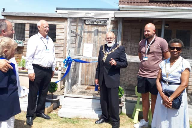 Pre-cutting of the ribbon for Rooney's Suite