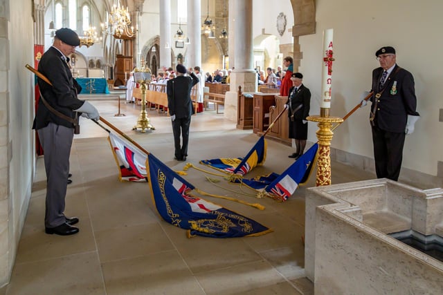 Standards lowered during the national anthem at Portsmouth Cathedral. Picture: Mike Cooter