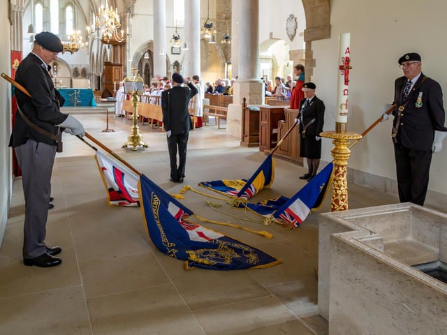 Standards lowered during the national anthem at Portsmouth Cathedral. Picture: Mike Cooter