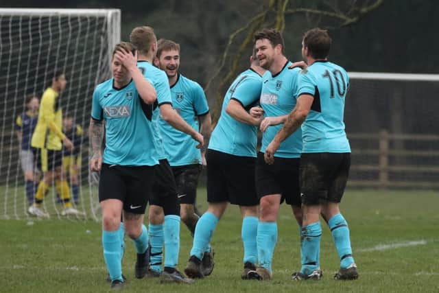 North End Lions (blue/black) celebrate a goal against Seagull Reserves. Picture: Kevin Shipp