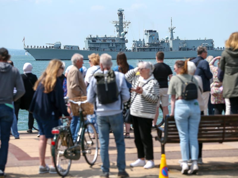 Crowd turn to look at saluting frigate.Picture: Chris Moorhouse (050624-047)